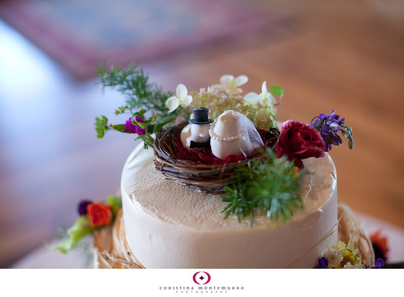 Round tiered wedding cake with wildflowers at Armstrong Farms birds nest cake topper